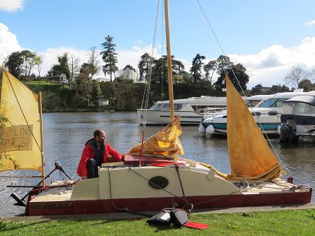 sailing scow on river